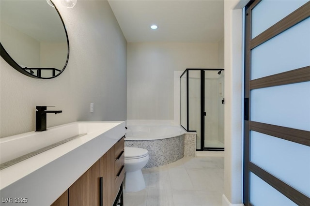 10908 Royal Highlands St, Las Vegas, NV 89141 - bathroom with vanity, a garden tub, toilet, a stall shower, and tile patterned flooring