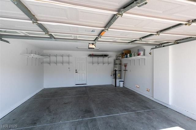 10908 Royal Highlands St, Las Vegas, NV 89141 - garage featuring water heater, a garage door opener, and baseboards
