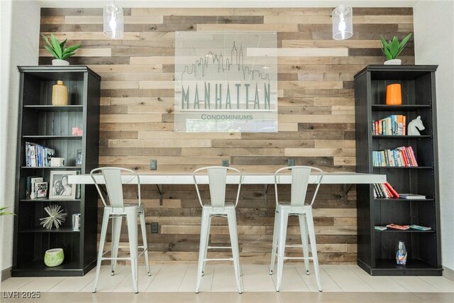 68 E Serene Ave Unit 224, Las Vegas, NV 89123 - bar area with wood walls and tile patterned floors
