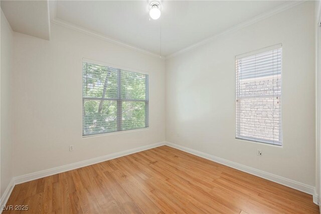 68 E Serene Ave Unit 224, Las Vegas, NV 89123 - empty room featuring light wood finished floors, crown molding, and baseboards