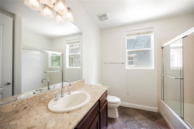 68 E Serene Ave Unit 224, Las Vegas, NV 89123 - bathroom with vanity, toilet, enclosed tub / shower combo, and baseboards