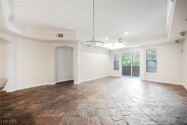 68 E Serene Ave Unit 224, Las Vegas, NV 89123 - spare room featuring a tray ceiling, stone tile flooring, arched walkways, crown molding, and a ceiling fan