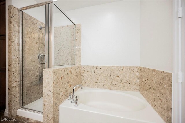 68 E Serene Ave Unit 224, Las Vegas, NV 89123 - bathroom with a bath and a stall shower