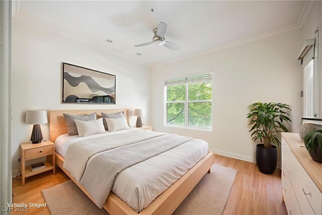 68 E Serene Ave Unit 224, Las Vegas, NV 89123 - bedroom featuring crown molding, light wood-style floors, baseboards, and a ceiling fan