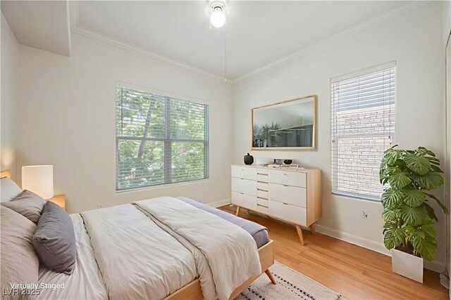 68 E Serene Ave Unit 224, Las Vegas, NV 89123 - bedroom with light wood-style flooring, crown molding, and baseboards