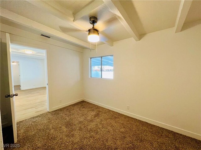 700 N Minnesota St, Las Vegas, NV 89107 - carpeted spare room featuring beam ceiling, ceiling fan, and baseboards