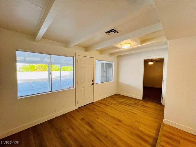 700 N Minnesota St, Las Vegas, NV 89107 - spare room with beam ceiling, baseboards, wood finished floors, and ceiling fan