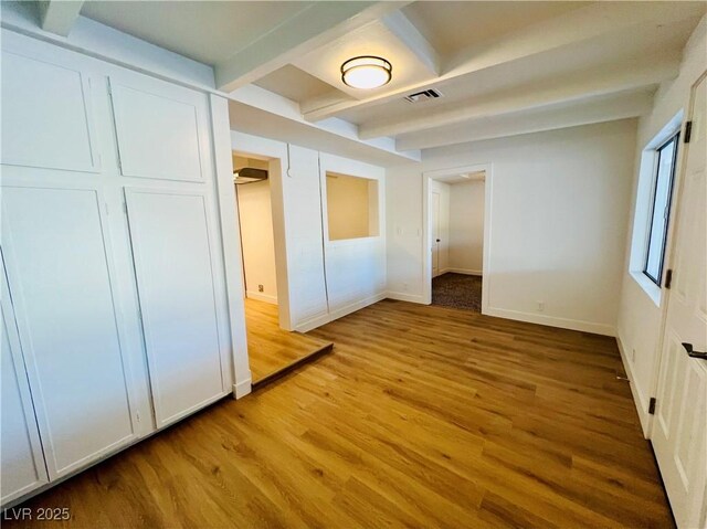 700 N Minnesota St, Las Vegas, NV 89107 - unfurnished bedroom with light wood-type flooring, beam ceiling, and baseboards