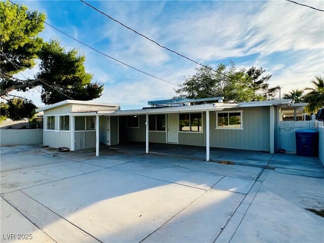 700 N Minnesota St, Las Vegas, NV 89107 - view of front facade with an attached carport and driveway
