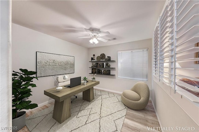 3050 Whispering Crest Dr, Henderson, NV 89052 - home office featuring wood finished floors, a ceiling fan, and baseboards