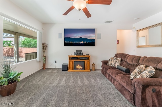2413 Mourning Warbler Ave, North Las Vegas, NV 89084 - living room featuring a ceiling fan and carpet