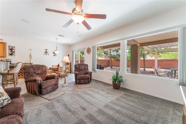 2413 Mourning Warbler Ave, North Las Vegas, NV 89084 - carpeted living area featuring ceiling fan and baseboards