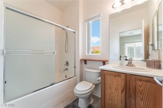 2413 Mourning Warbler Ave, North Las Vegas, NV 89084 - bathroom with toilet, vanity, bath / shower combo with glass door, and tile patterned flooring