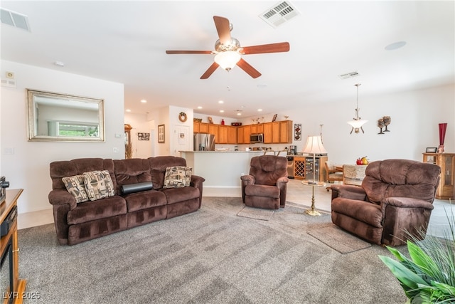2413 Mourning Warbler Ave, North Las Vegas, NV 89084 - living area featuring a ceiling fan, light carpet, and recessed lighting