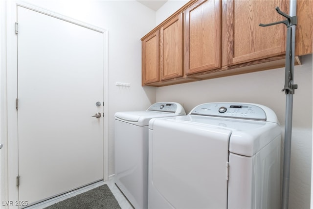 2413 Mourning Warbler Ave, North Las Vegas, NV 89084 - laundry room with washing machine and clothes dryer, cabinet space, and light tile patterned floors