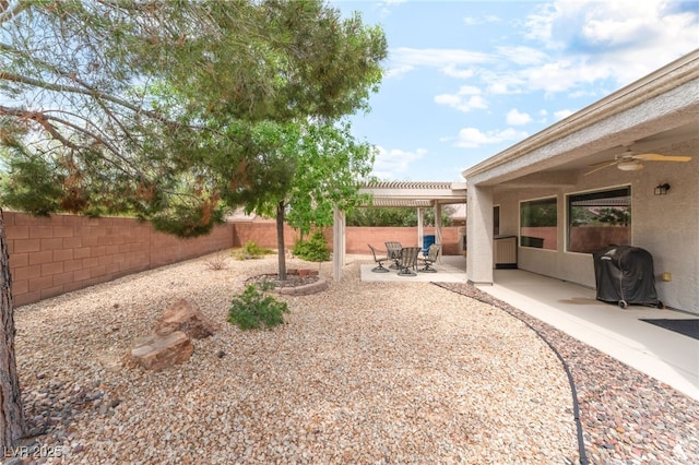 2413 Mourning Warbler Ave, North Las Vegas, NV 89084 - fenced backyard with a ceiling fan, a pergola, and a patio