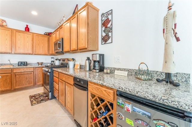 2413 Mourning Warbler Ave, North Las Vegas, NV 89084 - kitchen with appliances with stainless steel finishes, light tile patterned flooring, light stone counters, recessed lighting, and beverage cooler
