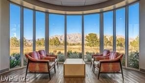 2413 Mourning Warbler Ave, North Las Vegas, NV 89084 - sunroom / solarium with wood finished floors and a mountain view