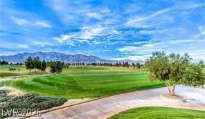 2413 Mourning Warbler Ave, North Las Vegas, NV 89084 - surrounding community featuring a mountain view and a yard