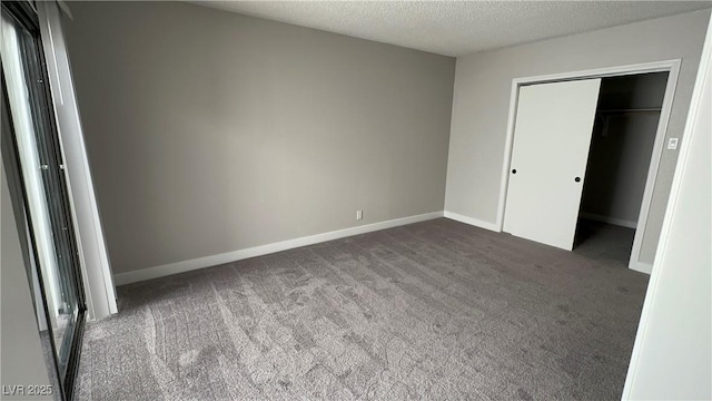 5720 Goldmount Ave, Las Vegas, NV 89107 - unfurnished bedroom with carpet flooring, a textured ceiling, baseboards, and a closet