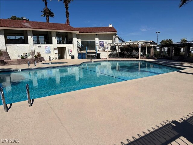 5720 Goldmount Ave, Las Vegas, NV 89107 - community pool featuring a patio area and a sink