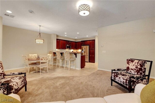 1560 Plaza Centre Dr Unit 103, Las Vegas, NV 89135 - living area with light colored carpet, baseboards, and recessed lighting
