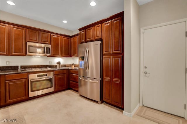 1560 Plaza Centre Dr Unit 103, Las Vegas, NV 89135 - kitchen featuring stainless steel appliances, recessed lighting, and dark stone countertops