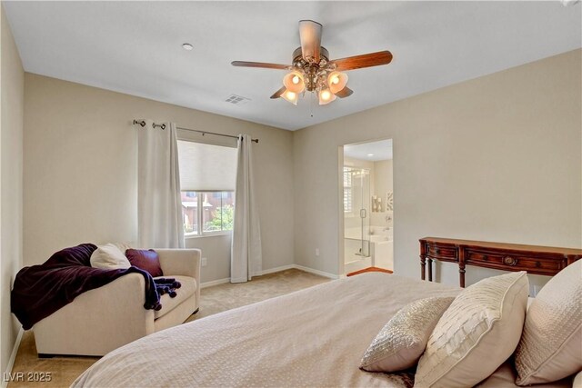 1560 Plaza Centre Dr Unit 103, Las Vegas, NV 89135 - carpeted bedroom featuring baseboards, ensuite bath, and ceiling fan