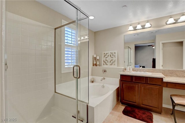 1560 Plaza Centre Dr Unit 103, Las Vegas, NV 89135 - full bathroom featuring a bath, a shower stall, vanity, tile patterned floors, and ceiling fan