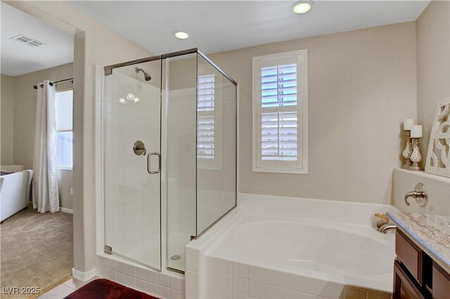 1560 Plaza Centre Dr Unit 103, Las Vegas, NV 89135 - full bath featuring a bath, a stall shower, vanity, recessed lighting, and baseboards