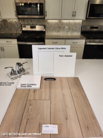 2776 Via Napoli, Henderson, NV 89044 - kitchen with appliances with stainless steel finishes and decorative backsplash