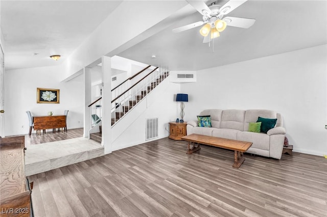 110 Huckleberry Ln, Henderson, NV 89074 - living area featuring wood finished floors, stairs, a ceiling fan, and baseboards
