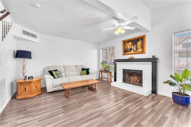 110 Huckleberry Ln, Henderson, NV 89074 - living area featuring wood finished floors, ceiling fan, a brick fireplace, baseboards, and stairway