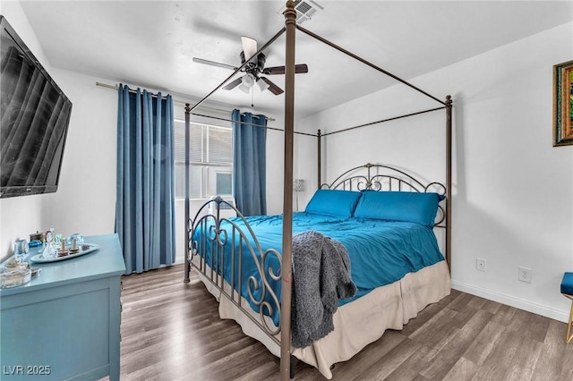 110 Huckleberry Ln, Henderson, NV 89074 - bedroom featuring wood finished floors, baseboards, and a ceiling fan