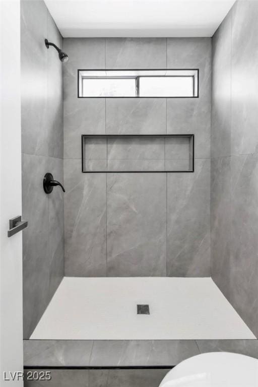 831 Purple Sage Ter, Henderson, NV 89015 - bathroom featuring a tile shower and toilet