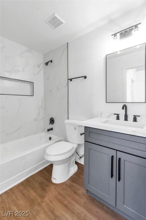 831 Purple Sage Ter, Henderson, NV 89015 - full bath with vanity, toilet, wood finished floors, and tub / shower combination