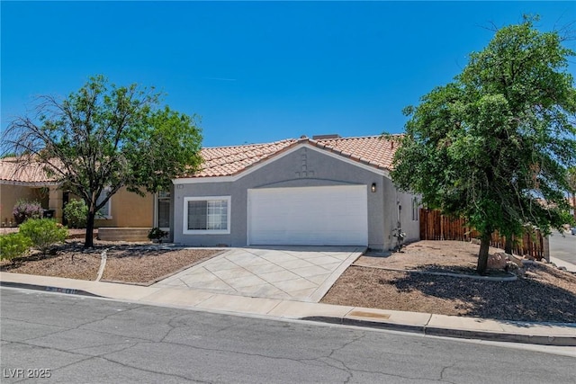 831 Purple Sage Ter, Henderson, NV 89015 - view of front of home with a garage, stucco siding, a tiled roof, and driveway