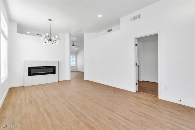 831 Purple Sage Ter, Henderson, NV 89015 - unfurnished living room featuring recessed lighting, a chandelier, light wood-style flooring, and baseboards