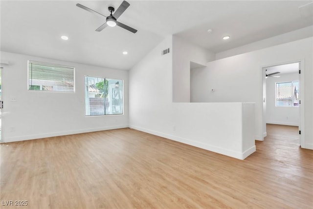 831 Purple Sage Ter, Henderson, NV 89015 - empty room with a ceiling fan, healthy amount of natural light, light wood-style floors, lofted ceiling, and recessed lighting