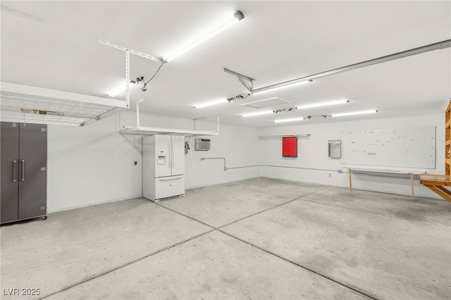 1505 Irene Dr, Boulder City, NV 89005 - garage with white fridge with ice dispenser and electric panel