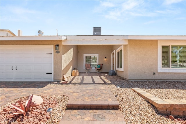 1505 Irene Dr, Boulder City, NV 89005 - rear view of property with stucco siding and a garage