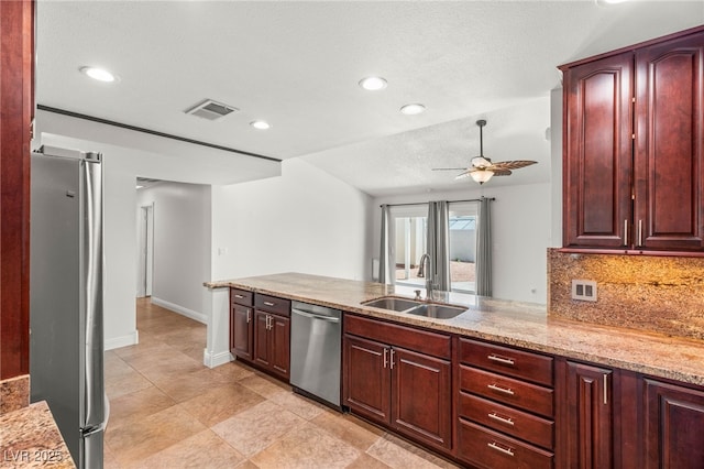 1505 Irene Dr, Boulder City, NV 89005 - kitchen featuring stainless steel appliances, a sink, ceiling fan, decorative backsplash, and recessed lighting