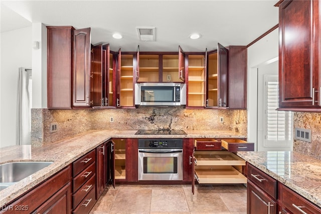 1505 Irene Dr, Boulder City, NV 89005 - kitchen featuring stainless steel appliances, light stone counters, reddish brown cabinets, backsplash, and glass insert cabinets