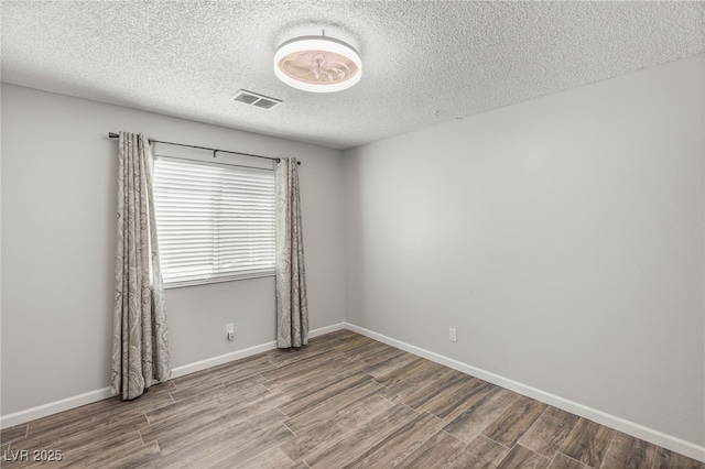 1505 Irene Dr, Boulder City, NV 89005 - spare room with wood finished floors, a textured ceiling, and baseboards