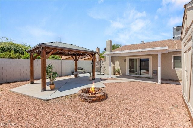 1505 Irene Dr, Boulder City, NV 89005 - fenced backyard featuring a gazebo, a fire pit, and a patio