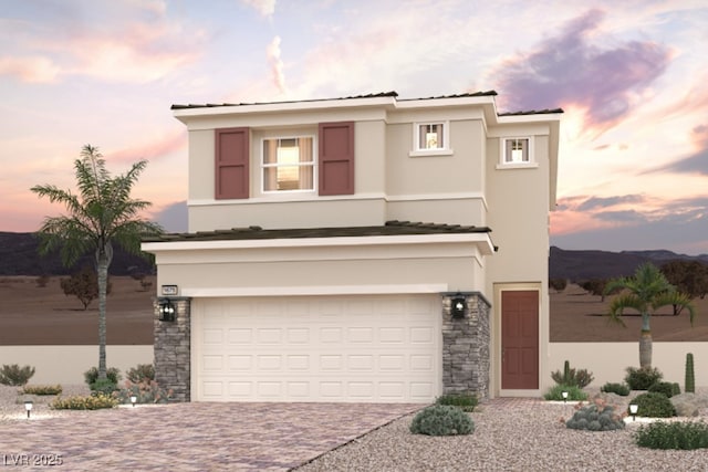 263 Kobuk Ave, Henderson, NV 89011 - traditional-style home with driveway, stucco siding, an attached garage, and stone siding