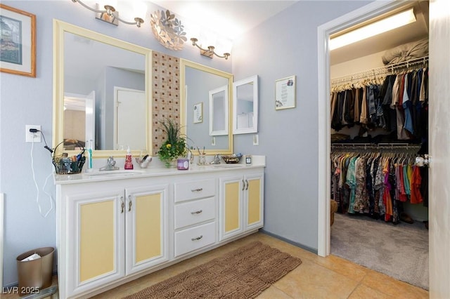 3404 Brayton Mist Dr, North Las Vegas, NV 89081 - bathroom featuring double vanity, a spacious closet, and tile patterned flooring