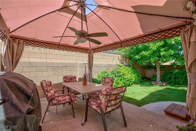 3404 Brayton Mist Dr, North Las Vegas, NV 89081 - view of patio featuring ceiling fan, outdoor dining space, and a grill