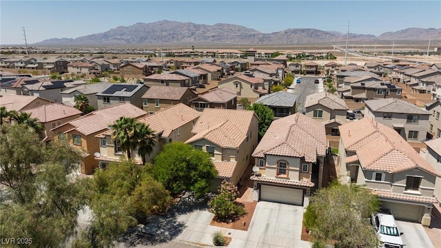 3404 Brayton Mist Dr, North Las Vegas, NV 89081 - aerial view of residential area featuring a mountainous background