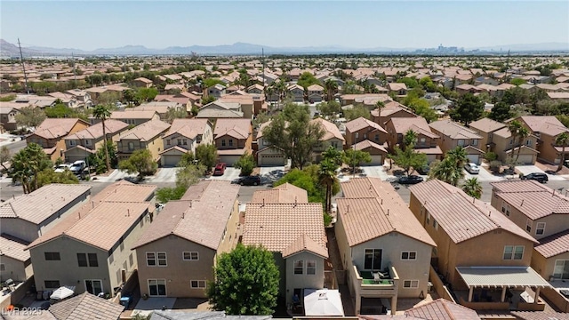 3404 Brayton Mist Dr, North Las Vegas, NV 89081 - aerial view of residential area with a mountainous background